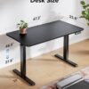 HUANUO 48" x 24" Electric Standing Desk Adjustable Height, 4 Memory Height Settings, Headphone Hook, Cable Manager, Sit Stand Up Desk for Home Office & Computer Workstation, Black