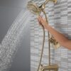 Delta 144840-CZ-I (Valve Included) Arvo 14 Series Single-Handle Tub Trim Kit Faucet with 4-Spray In2ition 2-in-1 Dual Hand Held Shower Head with Hose, Champagne Bronze